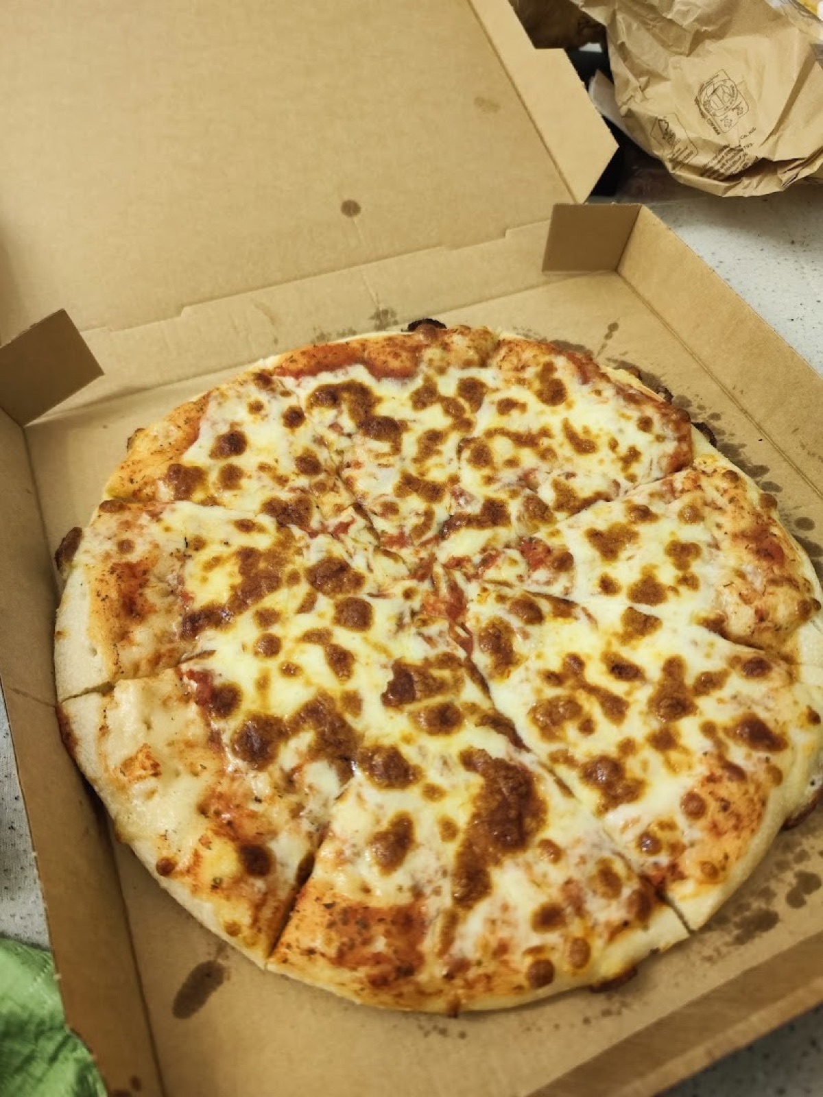 Original phone photo of cheese pizza in a box