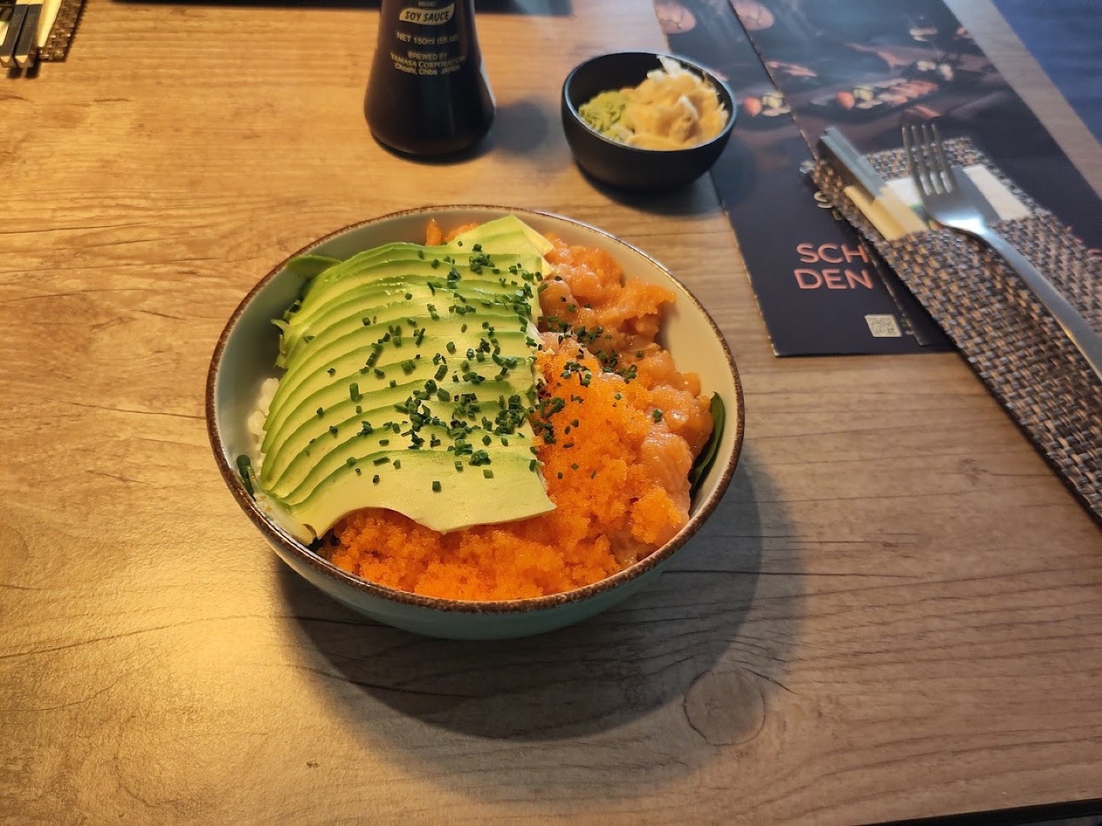 Original phone photo of an avocado salmon bowl