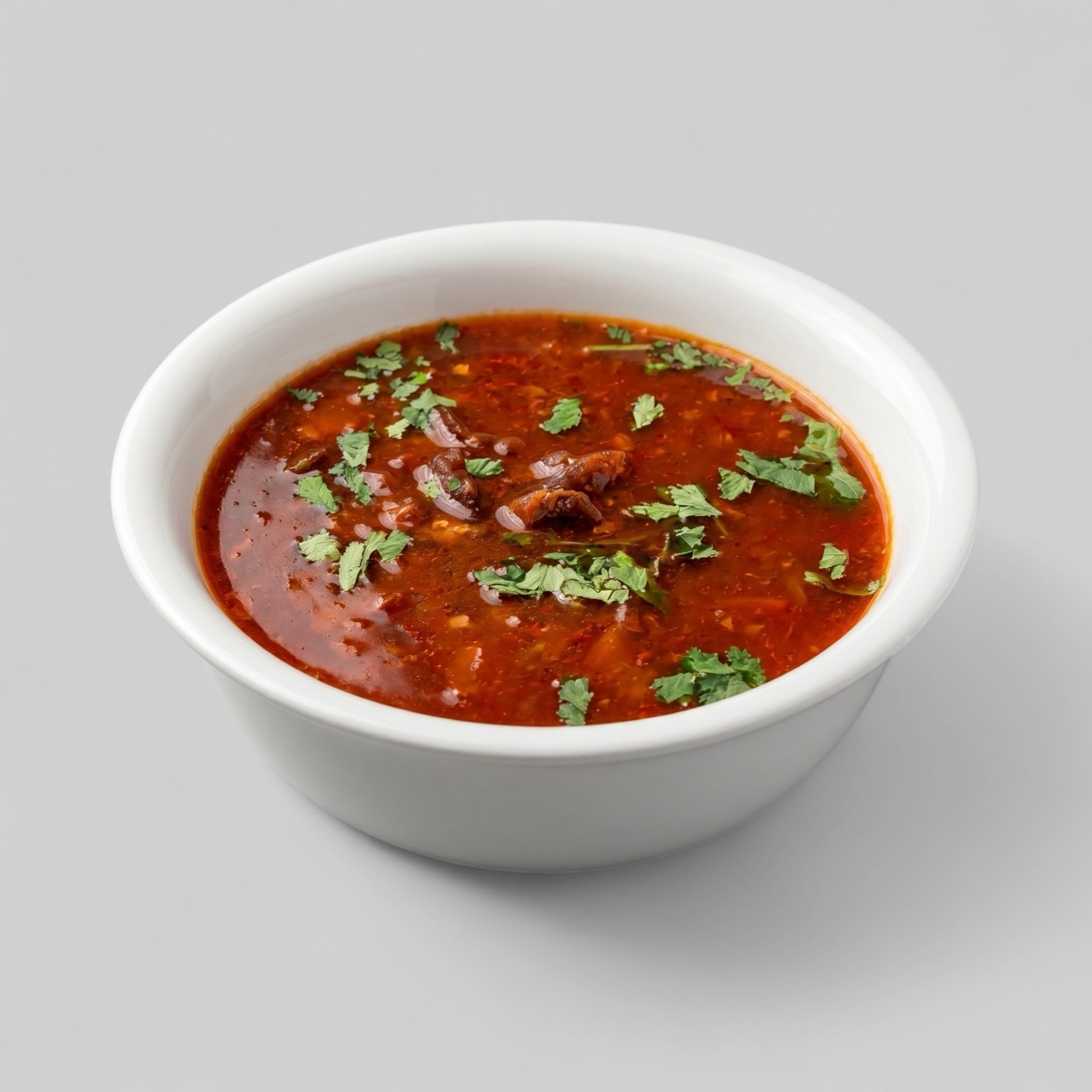 Splentify-enhanced tomato soup in a white bowl