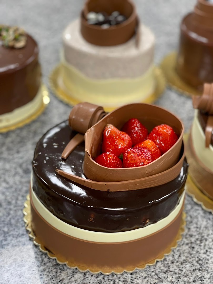 Original bakery counter photo of a chocolate strawberry cake