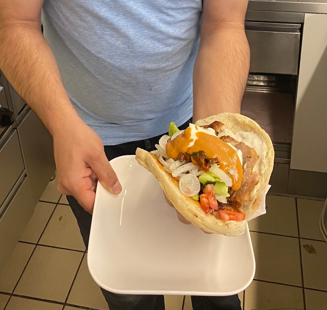 Original kitchen photo of a breakfast wrap on a white plate